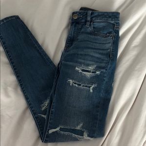 Light/medium washed jeans with distressing.